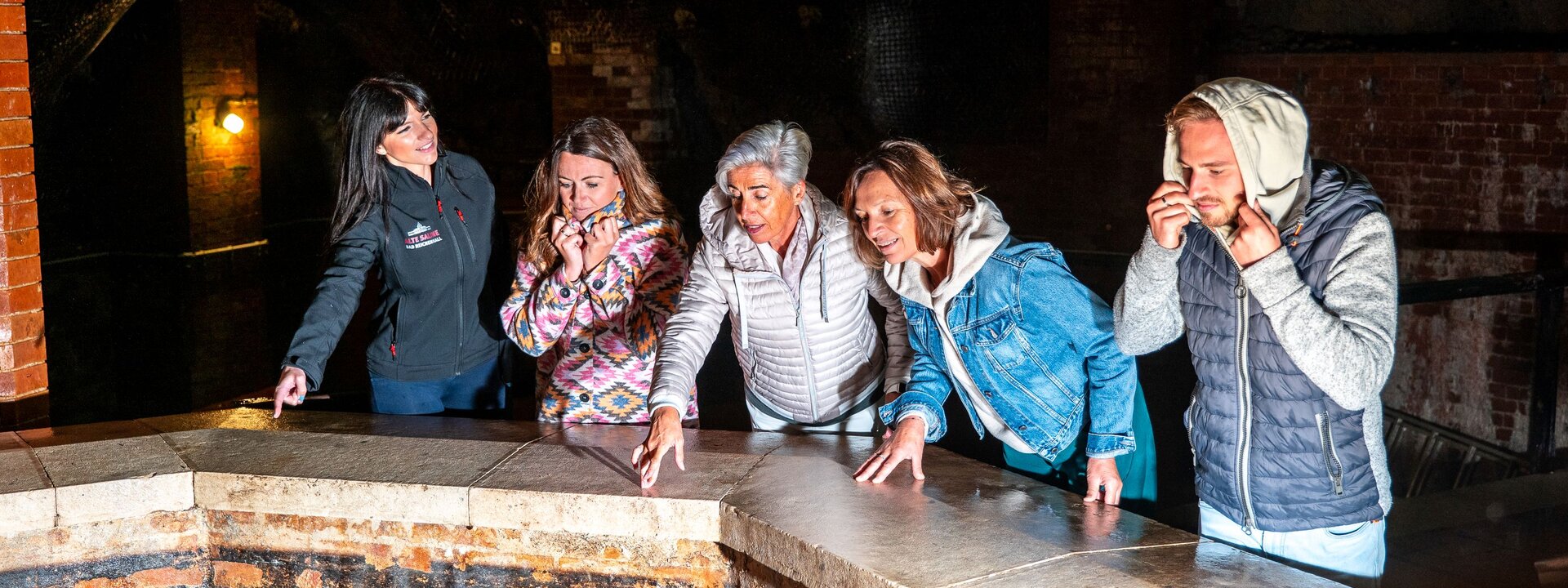 Guests look into the salt cave underground