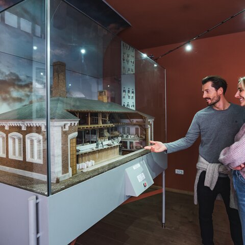 Couple in front of the brewhouse mockup