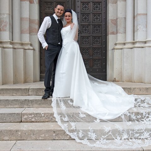 Happy bride and groom in front of the Saline Chapel