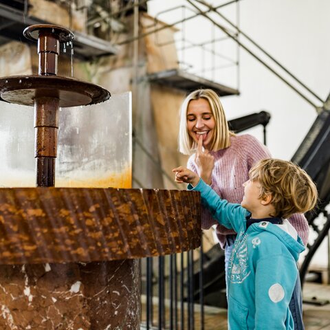 Mother and child checking out the brine