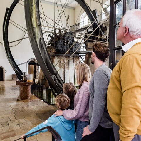 Family in front of the water wheels