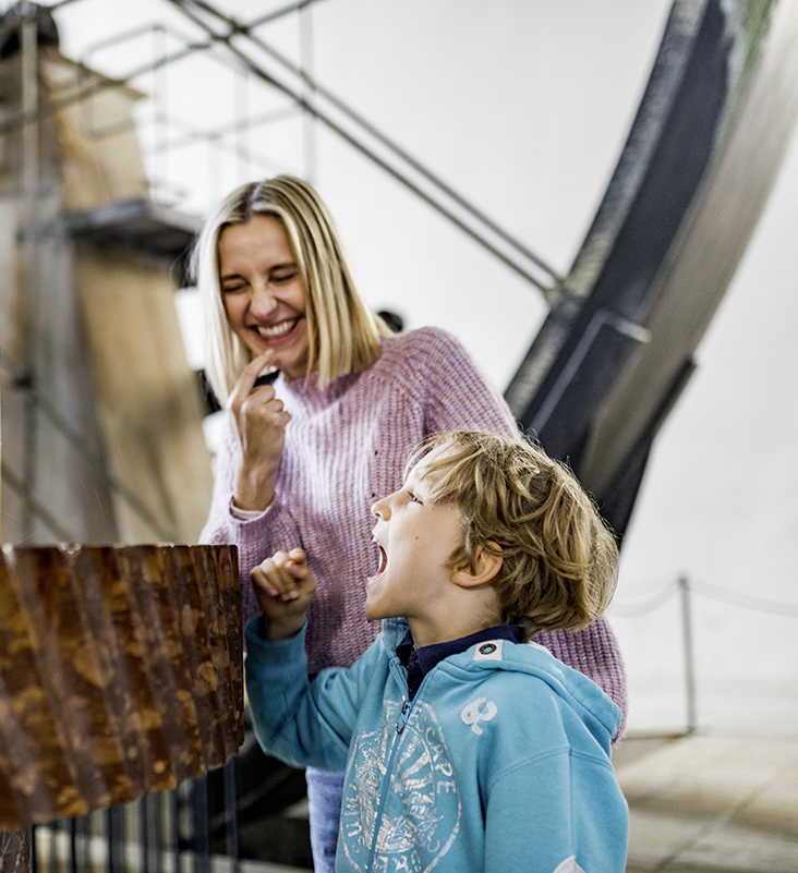A child admires the historic saltwater fountain at the Old Salt Works in Bad Reichenhall